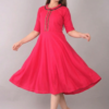 pink-womens-knee-length-dress-flow-motion.jpg Pink flared cotton kurti for women twirling pose showing flowy flare design