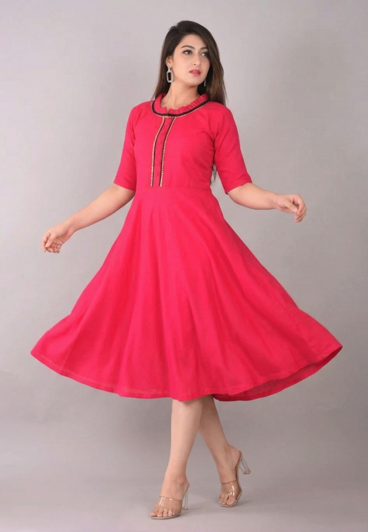 pink-womens-knee-length-dress-flow-motion.jpg Pink flared cotton kurti for women twirling pose showing flowy flare design