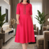 pink-womens-knee-length-dress-lifestyle-indoor.jpg Pink flared cotton kurti for women indoor lifestyle walking pose stylish ethnic wear