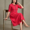 pink-womens-knee-length-dress-sitting-pose.jpg Pink flared cotton kurti for women sitting pose elegant indoor fashion look