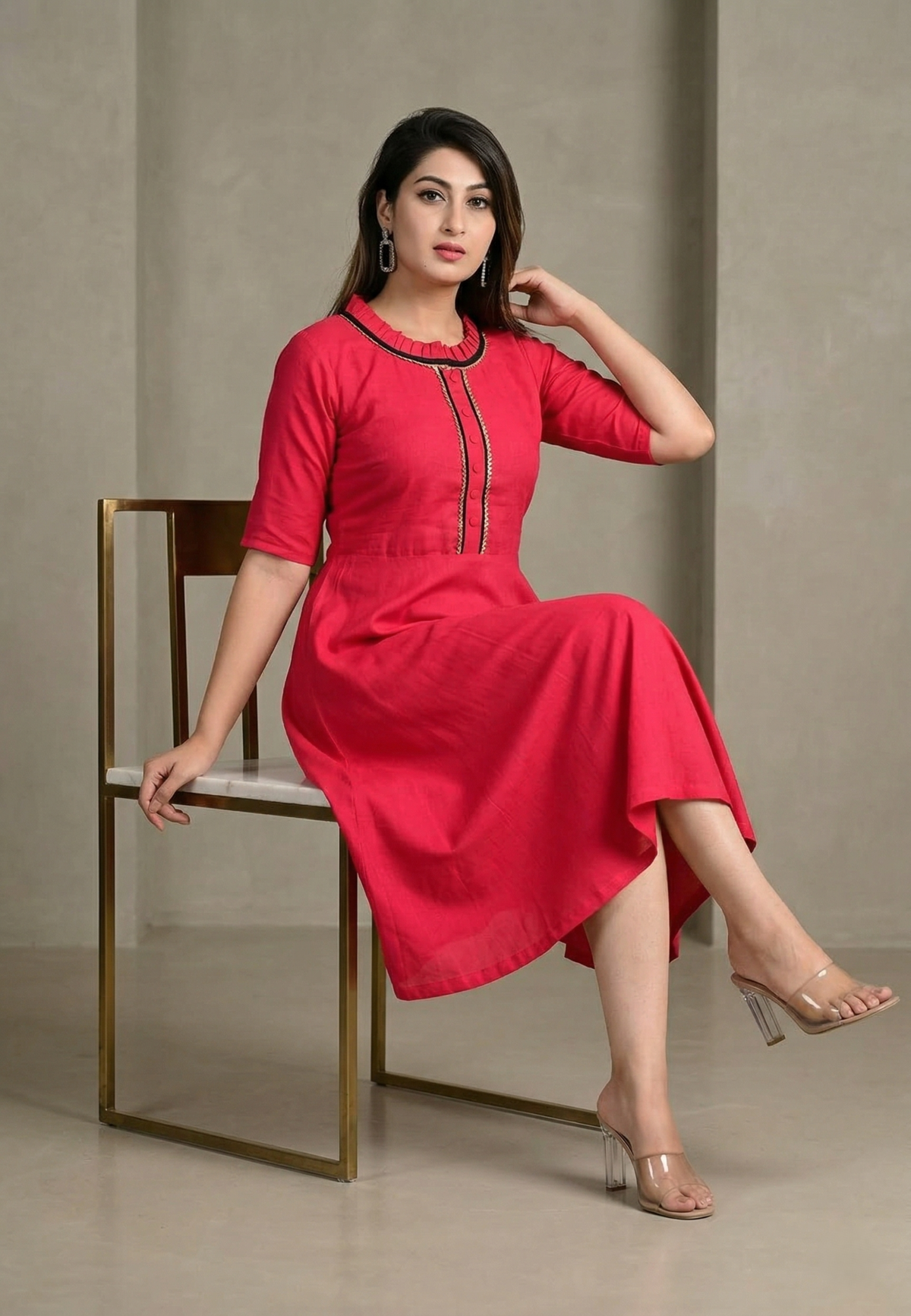 pink-womens-knee-length-dress-sitting-pose.jpg Pink flared cotton kurti for women sitting pose elegant indoor fashion look