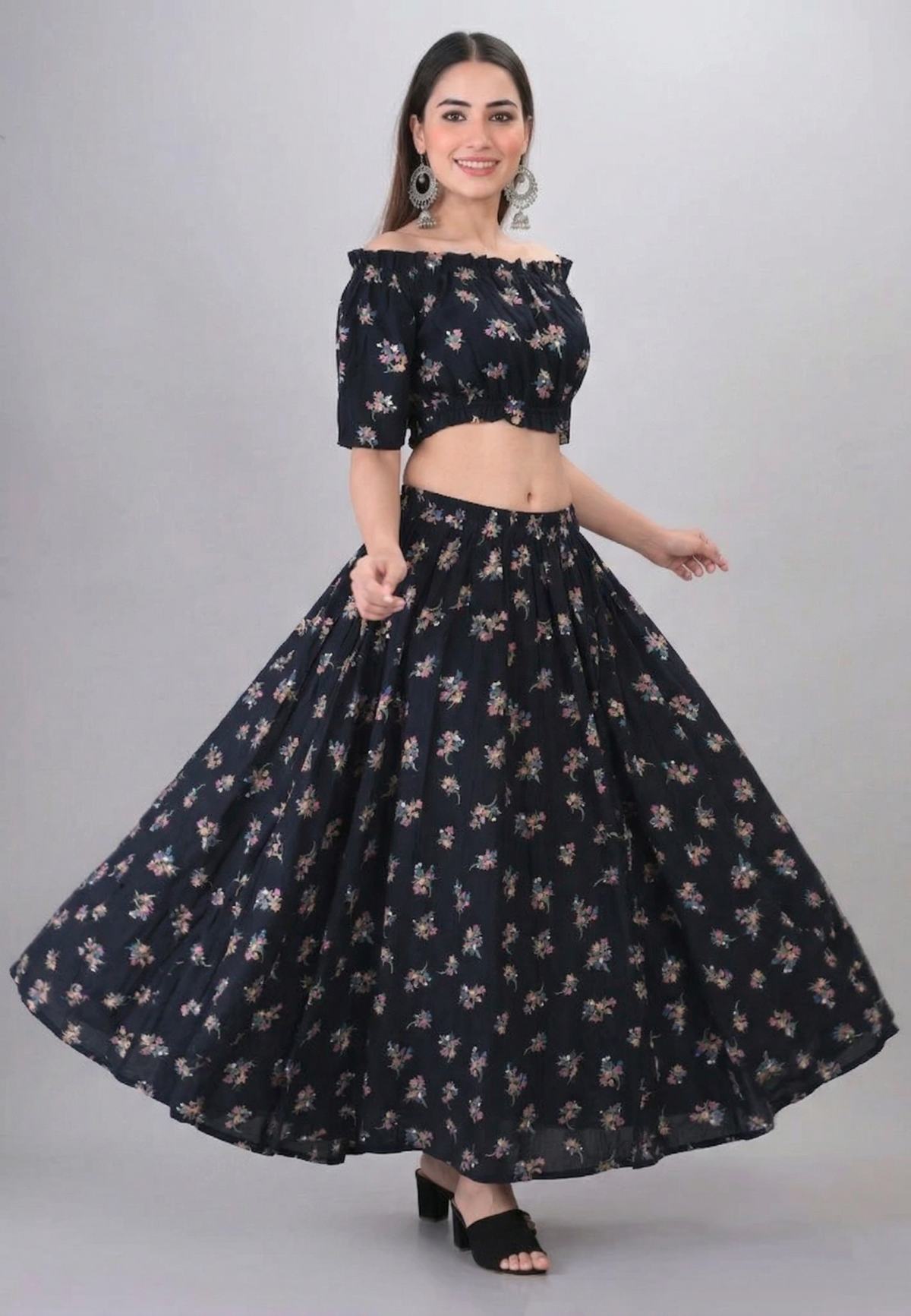 Flowy long skirt twirl shot of black floral off shoulder co-ord set